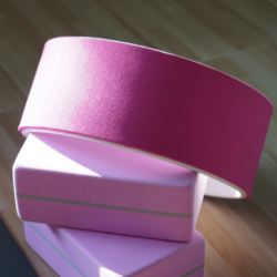 An image of a pink yoga wheel on top of two pink yoga blocks | Reinvent the Wheel with Holy Yoga's 20-hour on-demand Wheel Training!